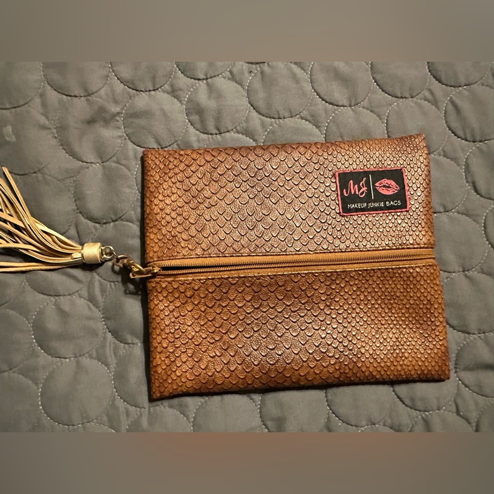 MAKEUP JUNKIE BRAND SMALL BROWN MAKEUP BAG.